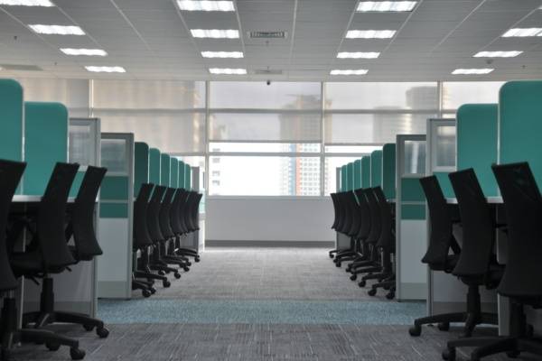 empty black rolling chairs at cubicles, IT Companies In Indore