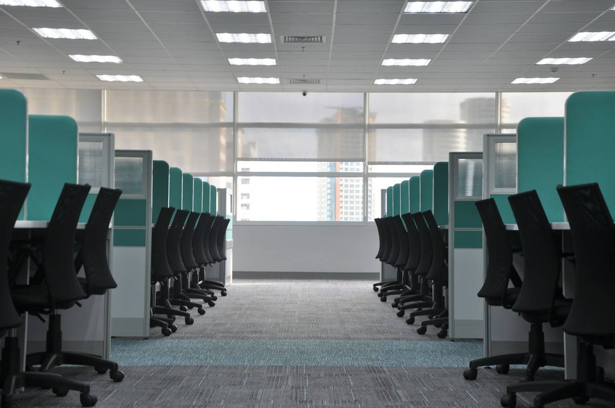 empty black rolling chairs at cubicles, IT Companies In Indore